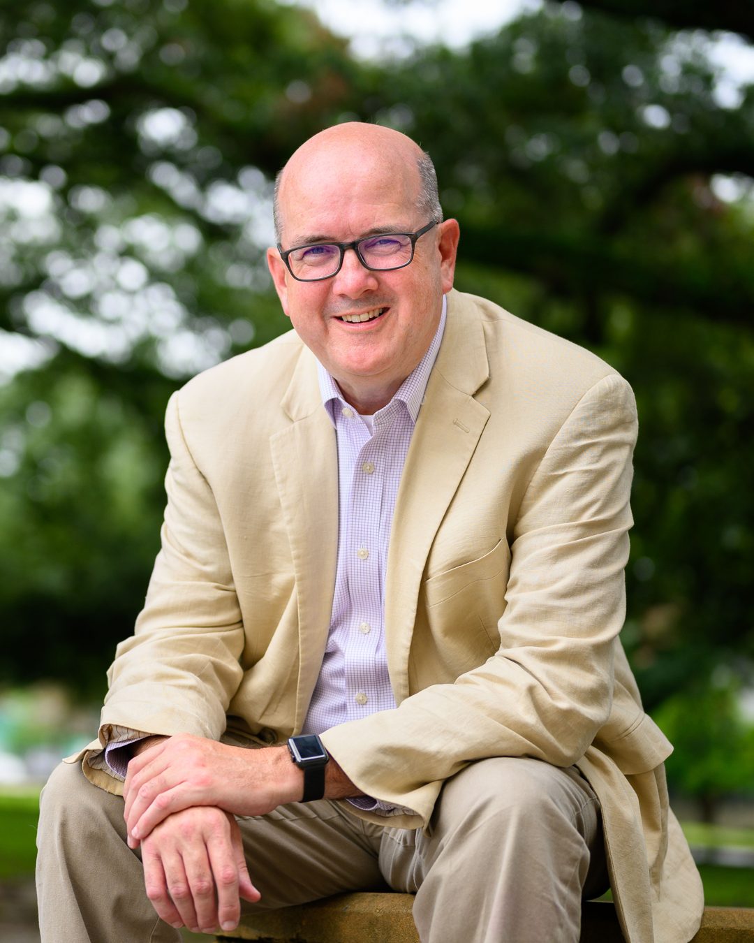 Patrick Martin seated under a live oak in a Baton Rouge park